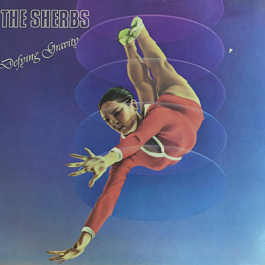 The Sherbs : Defying Gravity (LP, Album, Spe)